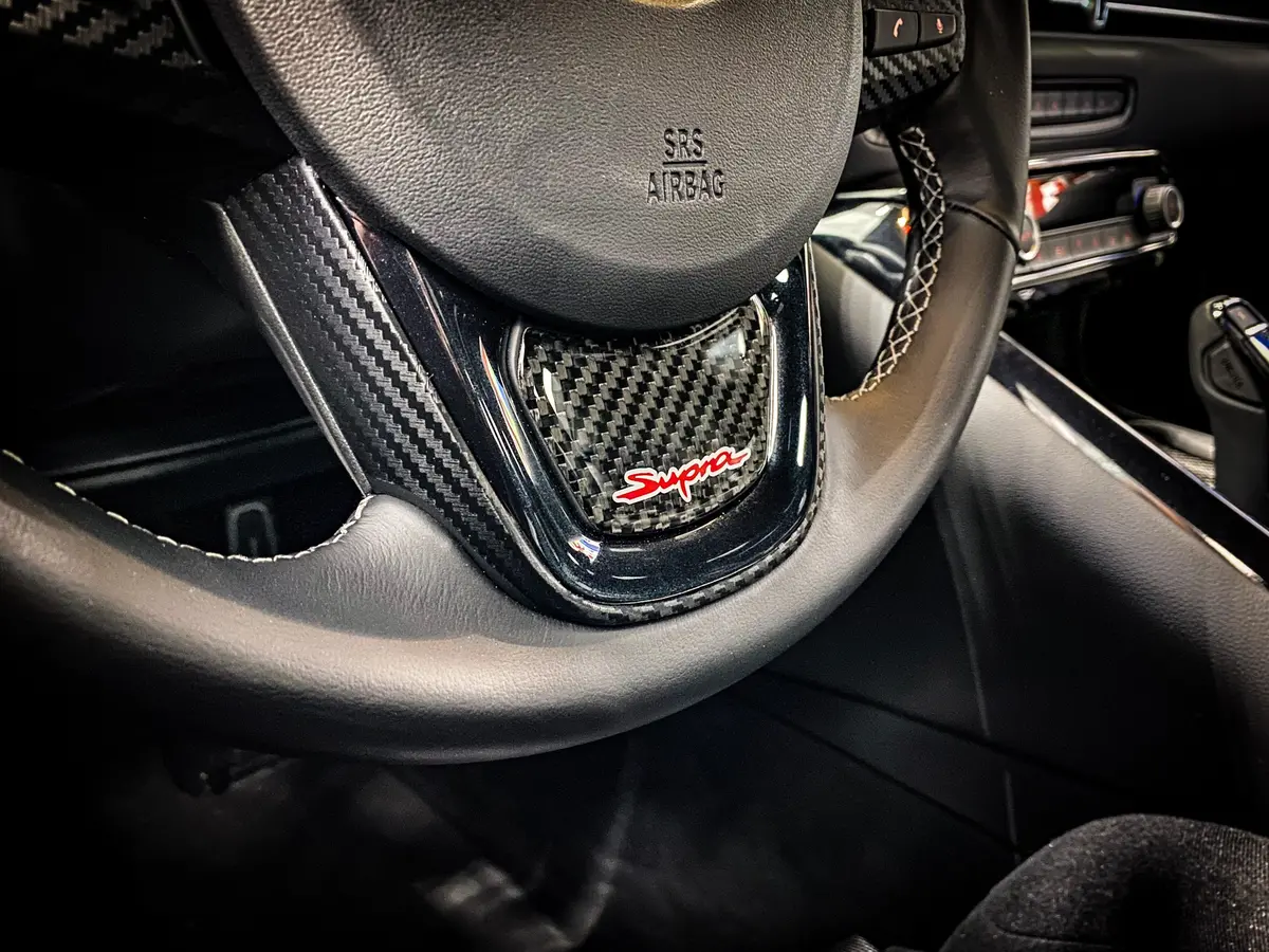 Real Carbon "Supra" Steering Wheel Trim Overlay (Lower) - 2020+ Supra 1