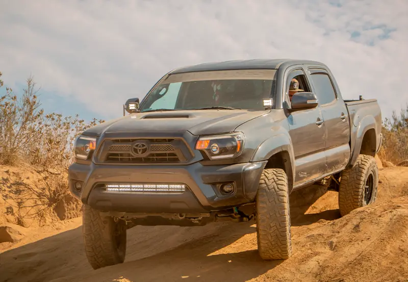 Cali Raised Low-Profile Ditch Light Mounting Kit For 2005–2015 Toyota Tacoma — Tall Design With Amber Backlight 1